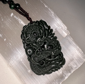 Hand carved jade on sale pendant